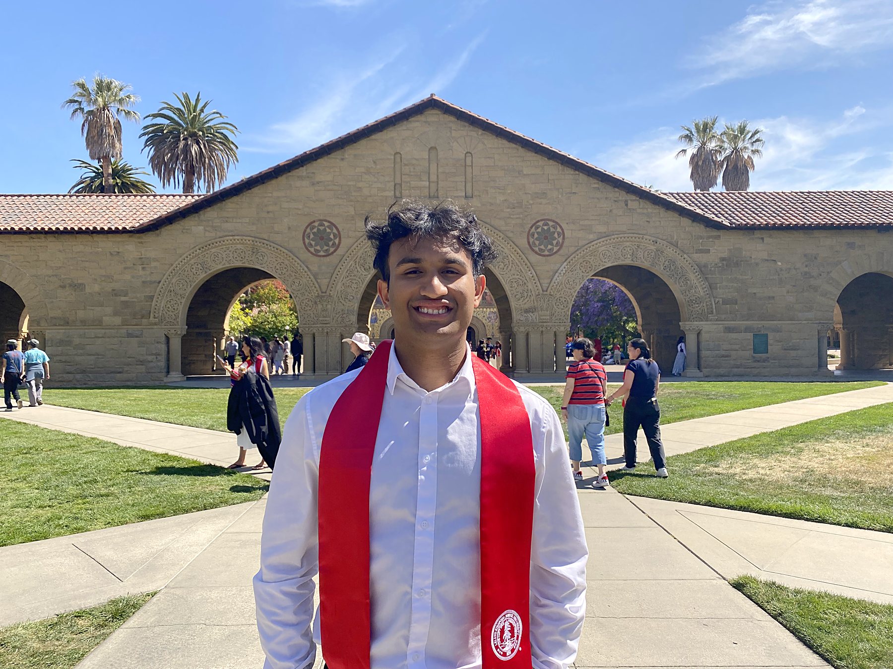 Aqib in a Stanford graduation stole on Stanford's Main Quad